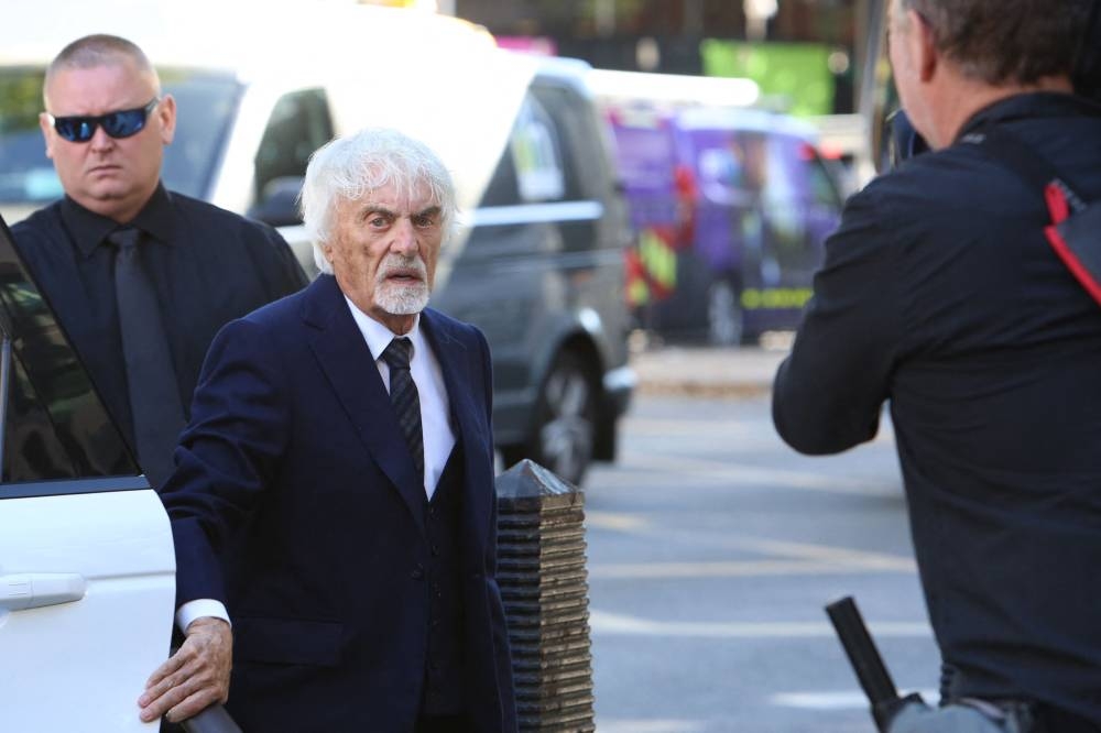 Ex-Formula One chief Bernie Ecclestone arrives at the Westminster Magistrates’ Court in central London, August 22, 2022 to face fraud charges. — AFP pic