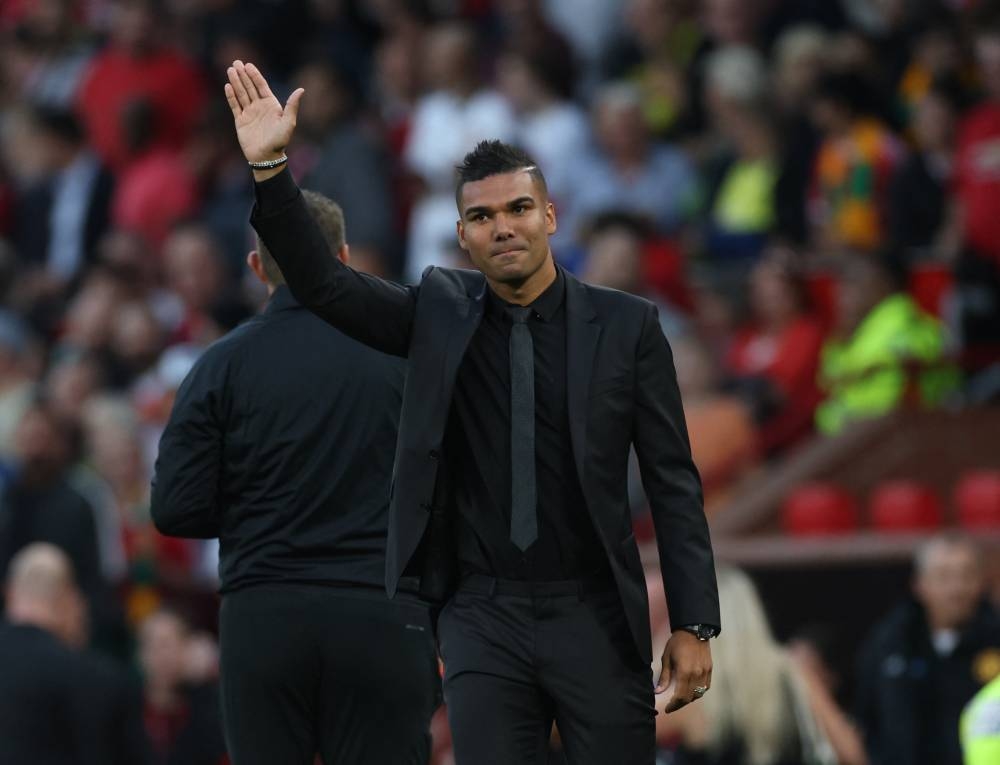 New Manchester United signing Casemiro waves to fans before the match against Liverpool at Old Trafford, Manchester August 22, 2022. — Reuters pic