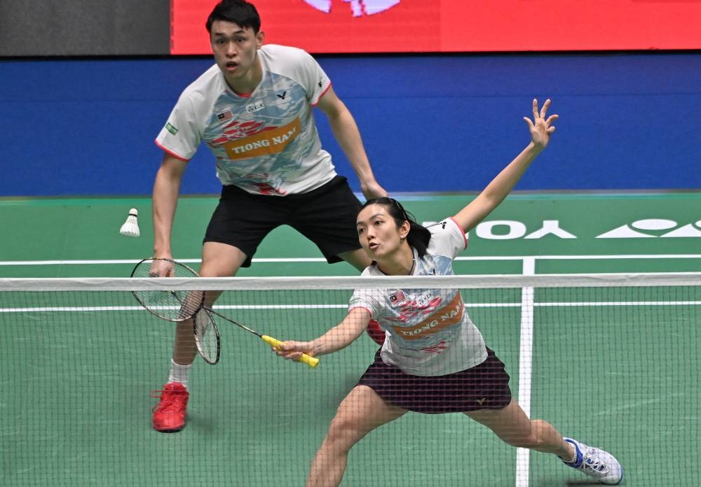 Kiang Meng-Pei Jing, seeded eighth in the championships took just 22 minutes to overcome the duo 21-6, 21-5 at the Tokyo Metropolitan Gymnasium. — AFP pic