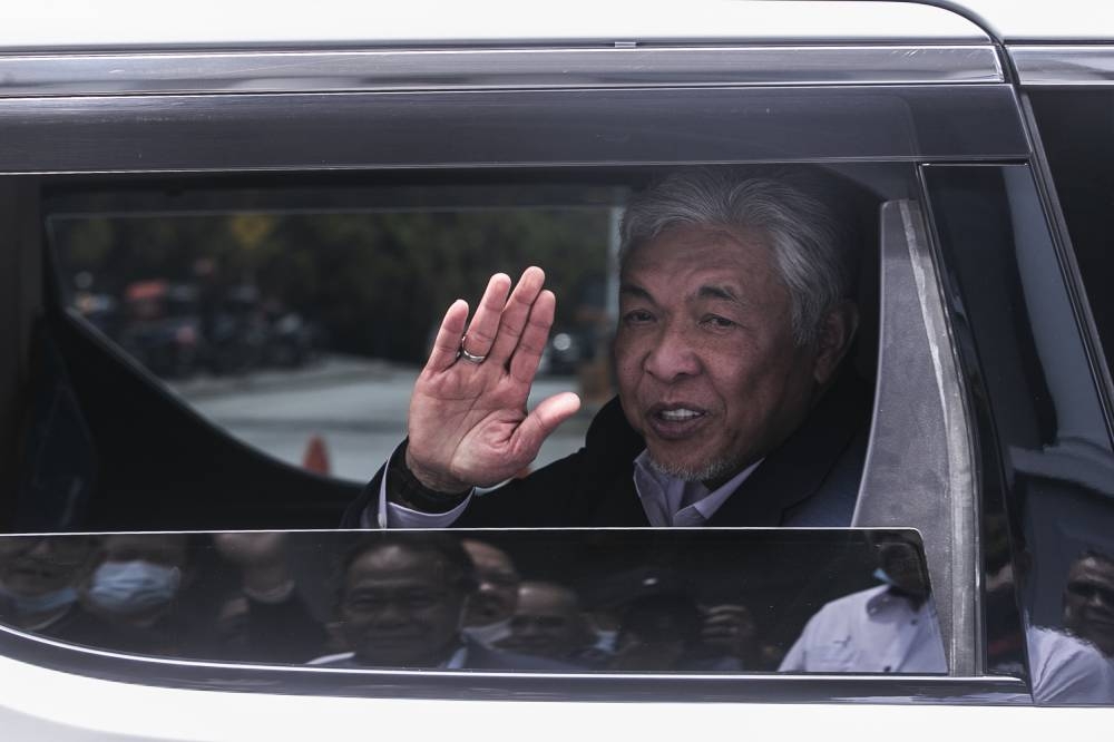 In his posting, Datuk Seri Ahmad Zahid Hamidi also called on Umno members to continue standing behind Datuk Seri Najib Razak, adding that the party’s political bureau would meet soonest. — Picture by Hari Anggara