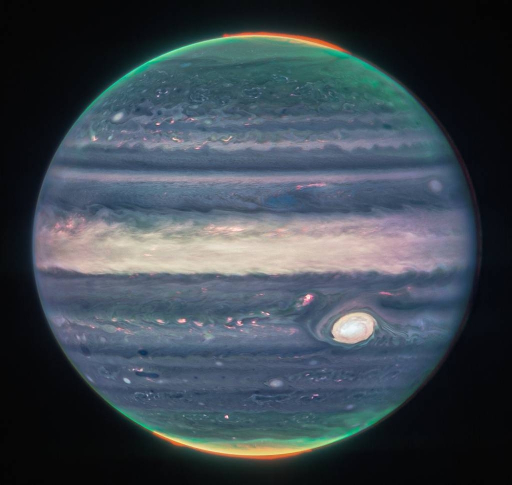 In this image obtained from NASA and taken by the James Webb Space Telescope, shows Jupiter's weather patterns, tiny moons, altitude levels, cloud covers and auroras at the northern and southern poles. — AFP/Nasa, ESA, CSA, Jupiter ERS Team pic; image processing by Judy Schmidt