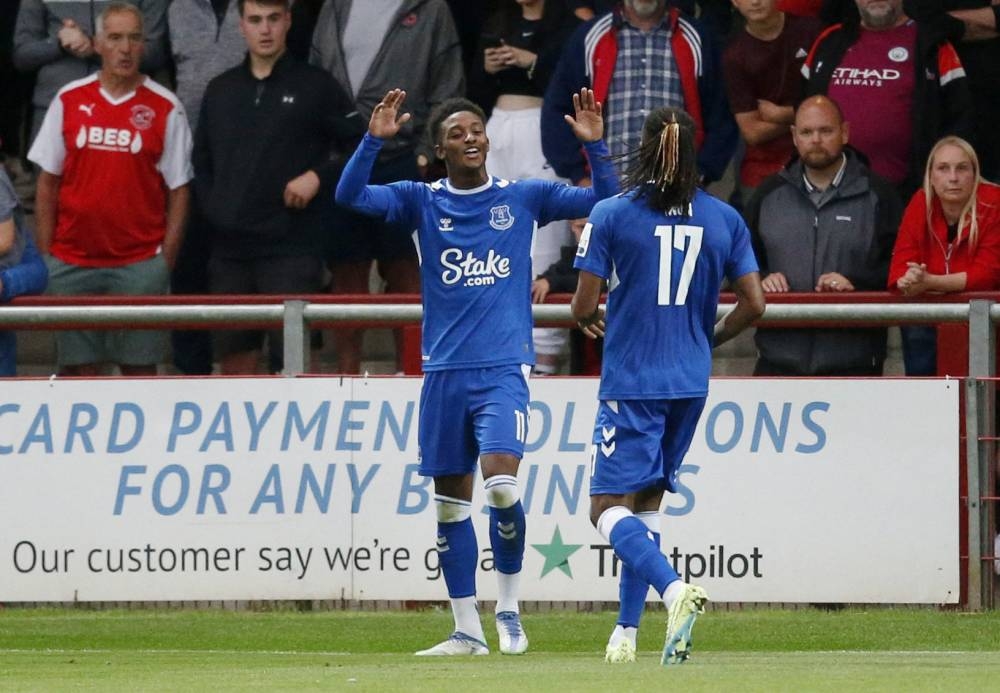 Everton's Demarai Gray celebrates scoring their first goal against Fleetwood Town with Alex Iwobi at the Highbury Stadium, Fleetwood August 23, 2022. — Reuters pic