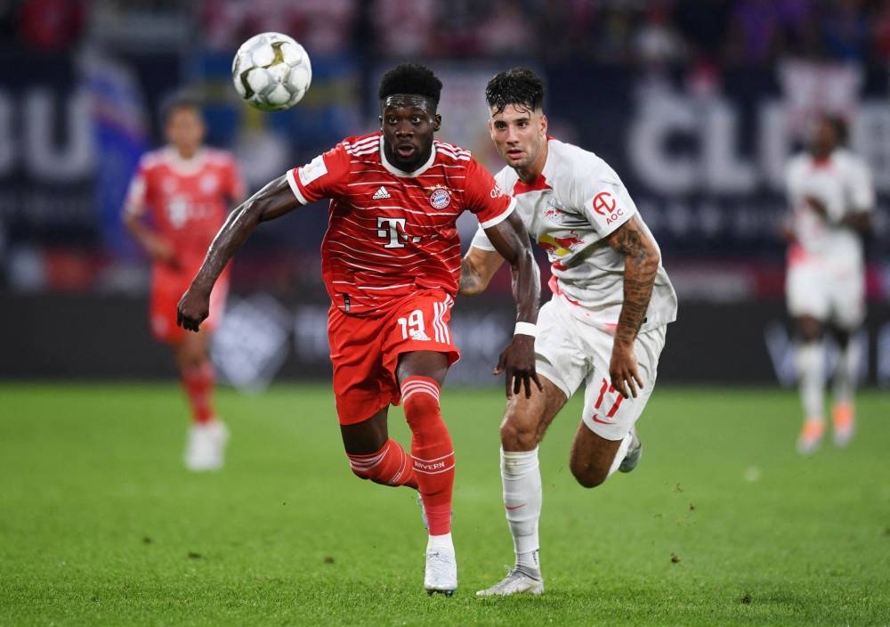 Bayern Munich’s Alphonso Davies in action with RB Leipzig’s Dominik Szoboszlai during the DFL Super Cup at the Red Bull Arena, Leipzig July 30, 2022. — Reuters pic