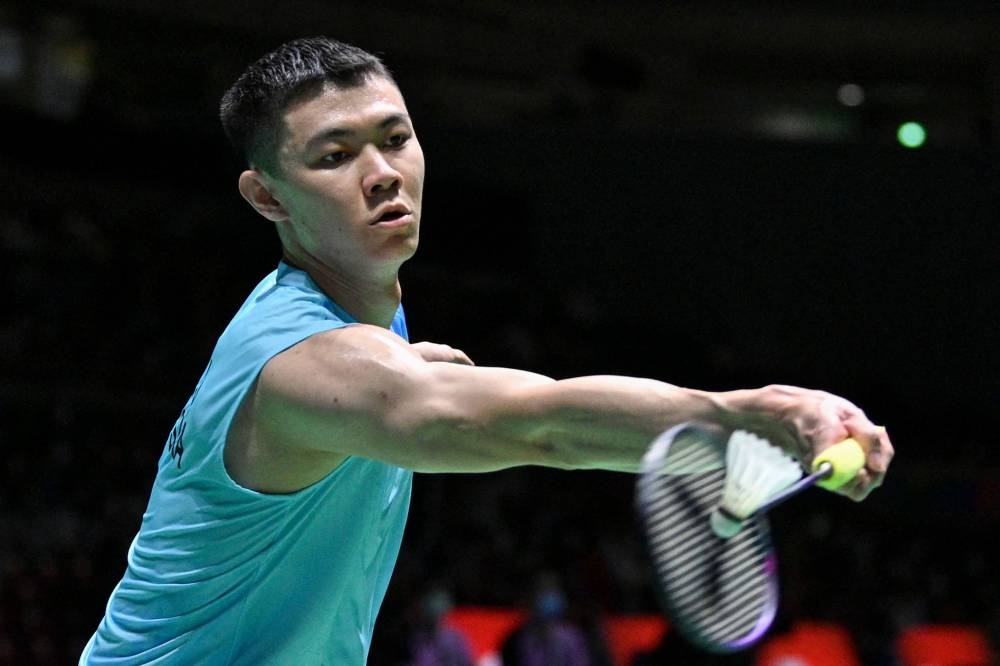 Malaysia’s Lee Zii Jia returns a shot against Portugal’s Bernardo Atilano during their men’s singles match on day three of the Badminton World Championships in Tokyo, August 24, 2022. — AFP pic 