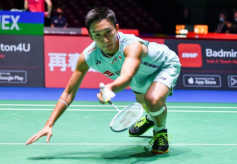 Japan’s Kento Momota hits a shot during the men’s singles match against India’s Prannoy H.S. on day three of the Badminton World Championships in Tokyo, August 24, 2022. — AFP pic 