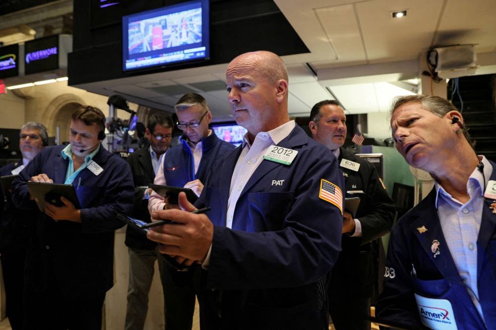 Traders work on the floor of the New York Stock Exchange in New York City August 22, 2022. — Reuters pic