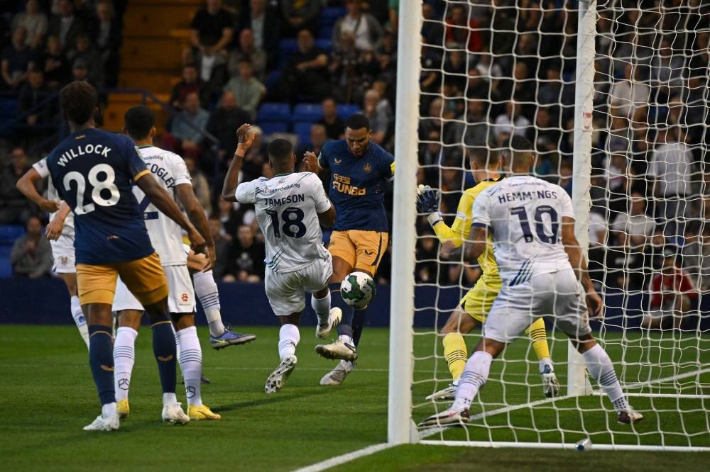 Newcastle United's Jamaal Lascelles  scores agaisnt Tranmere Rovers at Prenton Park Stadium in Birkenhead August 24, 2022. — AFP pic