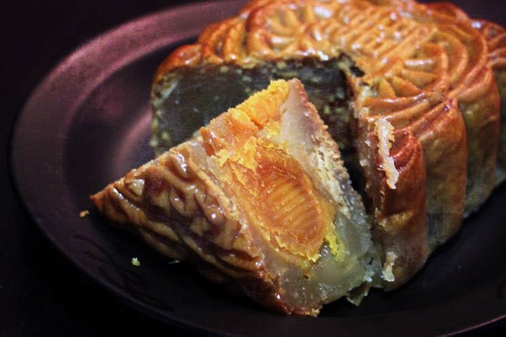 The roundness of the salted egg yolk nestled within promises a full life.