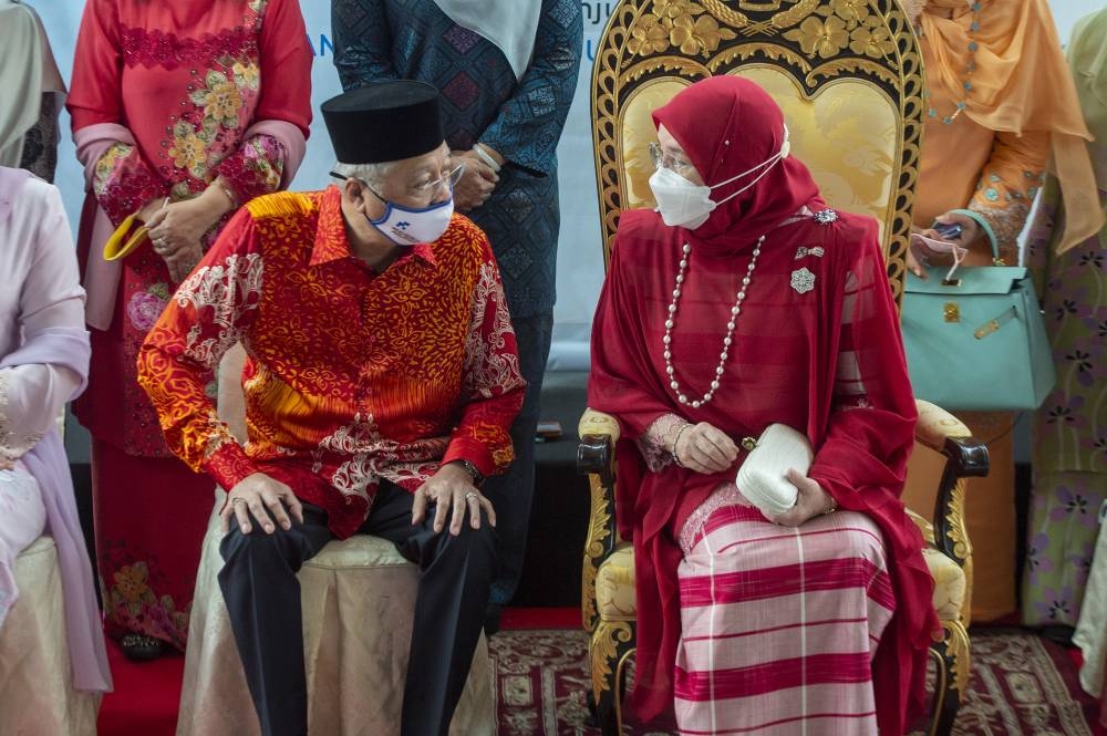Raja Permaisuri Agong Tunku Hajah Azizah Aminah Maimunah Iskandariah and Prime Minister Datuk Seri Ismail Sabri at the 60th Women's Day celebration in Kuala Lumpur August 25, 2022. — Picture by Shafwan Zaidon