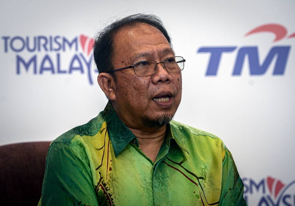 Tourism Malaysia director-general Datuk Zainuddin Abdul Wahab speaks during a press conference after signing a memorandum of cooperation (MoC) with Telekom Malaysia (TM) to promote the ‘Cuti-Cuti Malaysia’ campaign  in Kuala Lumpur August 25, 2022. — Bernama pic