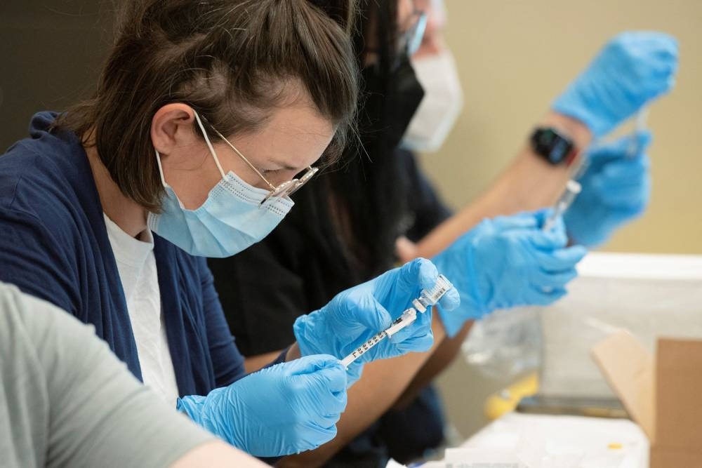 Volunteer pharmacist Lisa Beckett fills a syringe with one dose of the JYNNEOS smallpox and monkeypox vaccine during a clinic through the Pima County Department of Public Health at Abrams Public Health Centre in Tucson, Arizona August 20, 2022.  — Reuters pic