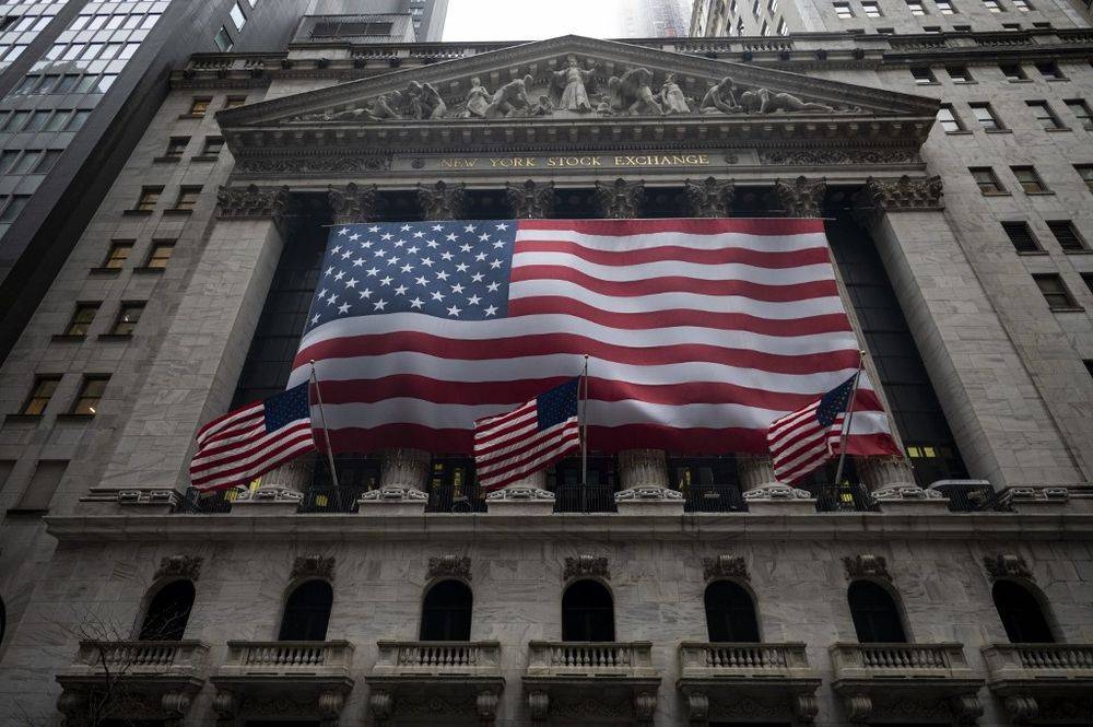 In this file photo the US flag is seen at the New York Stock Exchange (NYSE) on April 30, 2020 in New York City. — AFP pic