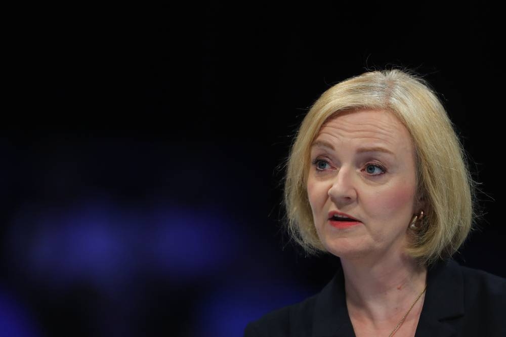 Liz Truss (pic) leads Rishi Sunak by wide margins in polls of the Tory grassroots set to chose their next leader, who will then become prime minister. — AFP pic 