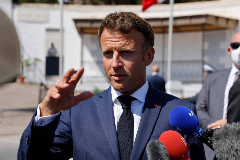 French President Emmanuel Macron speaks to the press after visiting the Christian cemetery of Saint-Eugene in Algiers on August 26, 2022. - The French president started a three-day visit to Algeria on August 25, to help mend ties with the former French colony, which this year marks its 60th anniversary of independence. — AFP pic 