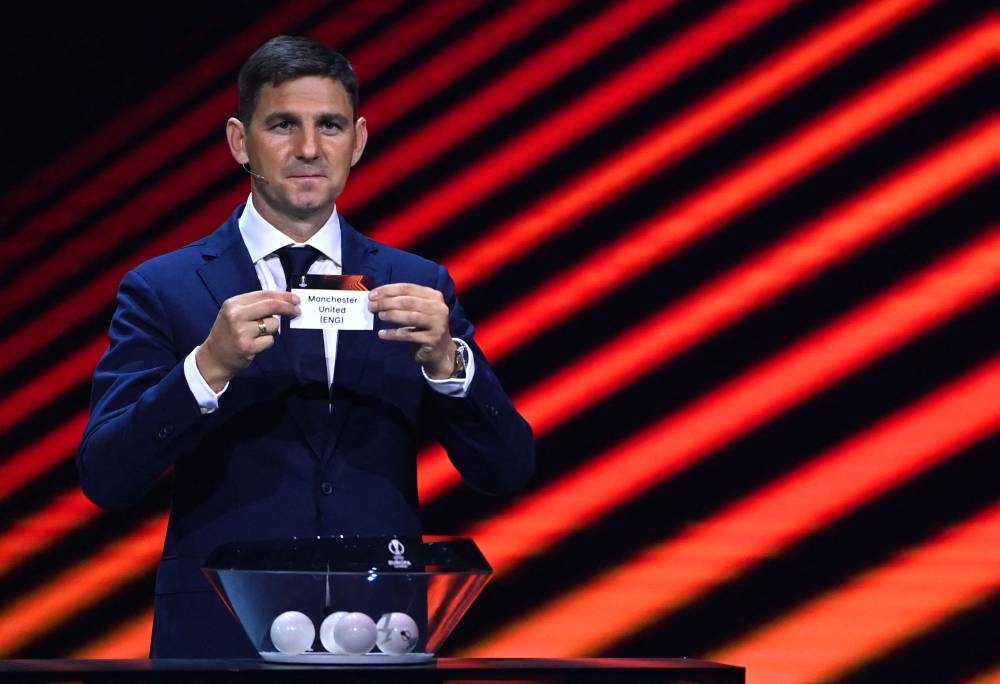 Hungary’s head coach Zoltan Gera shows the paper slip of Manchester United during the draw for the Uefa Europa League football tournament group stage 2022-2023 in Istanbul, August 26, 2022. — AFP pic 