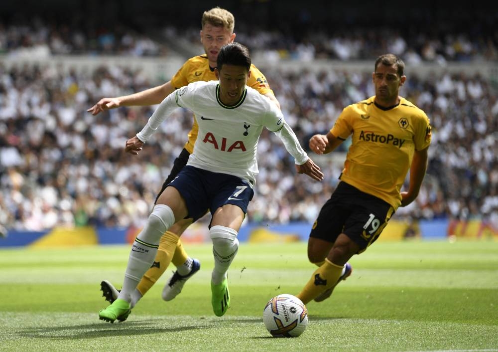 Tottenham Hotspur’s Son Heung-min in action with Wolverhampton Wanderers’ Nathan Collins and Jonny at Tottenham Hotspur Stadium, London, Britain, August 20, 2022. — Reuters pic   