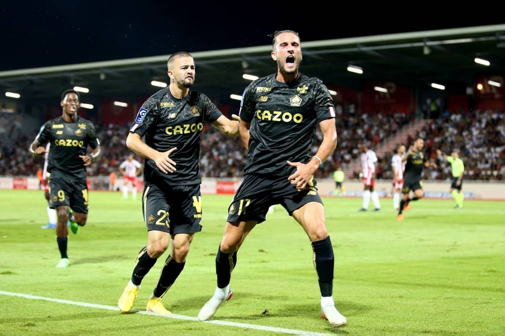 Lille midfielder Yusuf Yazici celebrates with teammates after scoring against AC Ajaccio at Stade Francois Coty in Ajaccio August 26, 2022. — AFP pic