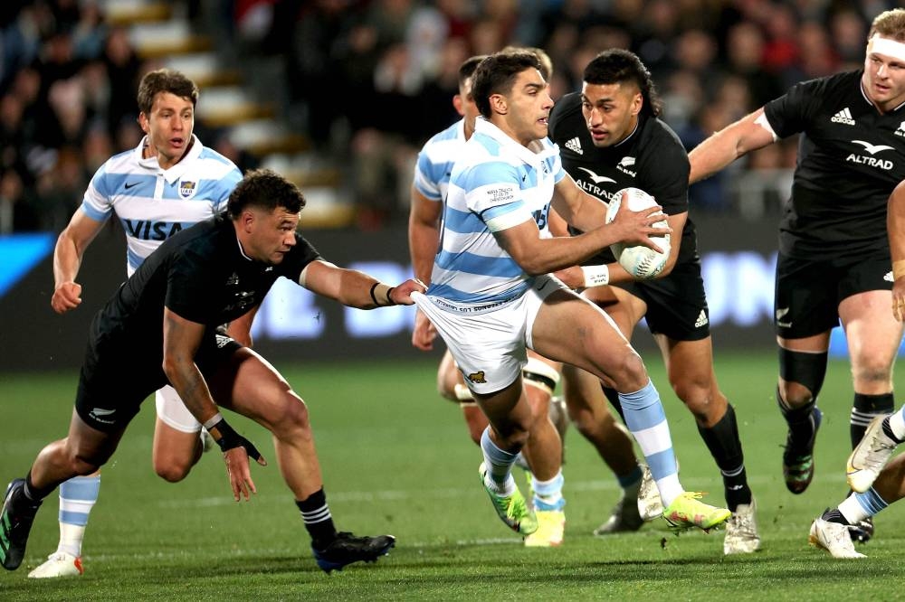 Argentina’s Santiago Carreras (right) is tackled by New Zealand’s David Havili (left) during the rugby union Test match between New Zealand and Argentina at Orangetheory Stadium in Christchurch on August 27, 2022. — AFP pic
