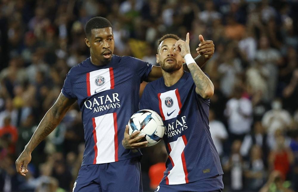 Paris St Germain's Neymar celebrates scoring their first goal against AS Monaco with Presnel Kimpembe at Parc des Princes, Paris August 28, 2022. — Reuters pic