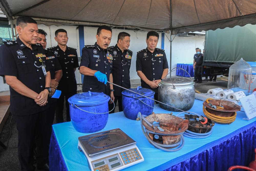 Perak police chief Datuk Mohd Yusri Hassan Basri (centre) addresses a press conference in Ipoh following a drug bust in Tapah August 29, 2022. — Picture by Farhan Najib