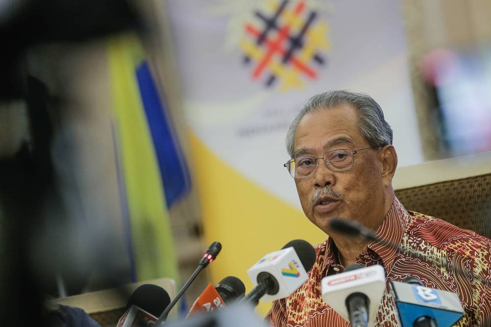 National Recovery Council Chairman Tan Sri Muhyiddin Yassin speaks to the press after chairing the National Recovery Council meeting at the Ministry of Finance in Putrajaya August 29, 2022. — Picture by Sayuti Zainudin