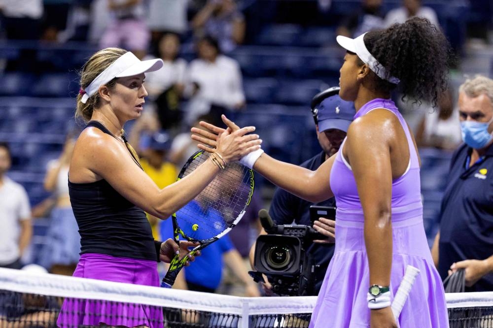 USA’s Danielle Collins and Japan’s Naomi Osaka greet each other at the net following their 2022 US Open Tennis tournament women’s singles first round match at the USTA Billie Jean King National Tennis Center in New York, August 30, 2022. — AFP pic 