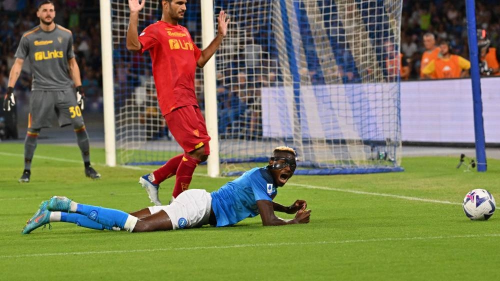 Napoli's Victor Osimhen reacts after being tackled during the match against Lecce at the Diego-Maradona stadium in Naples August 31, 2022. — AFP pic