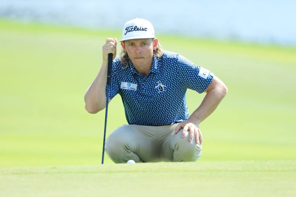 lines up a putt on the eighth green during the third round of the Tour Championship at the East Lake Golf Club in Atlanta August 27, 2022. — AFP pic 