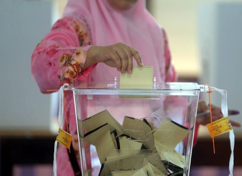 A voter casts her ballot in this undated file photograph. — Picture by Farhan Najib Yusoff