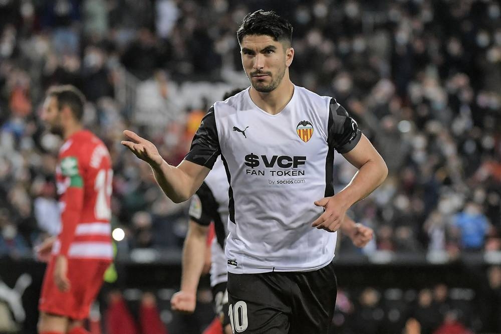 Valencia's Carlos Soler celebrates after scoring his team's third goal against Granada at the Mestalla Stadium in Valencia March 5, 2022. — AFP pic