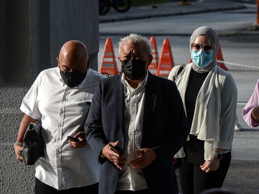 Kinabatangan MP Datuk Seri Bung Moktar Radin and his wife Datin Seri Zizie Izette Abdul Samad at the Kuala Lumpur Court Complex, April 12, 2022. — Bernama pic 