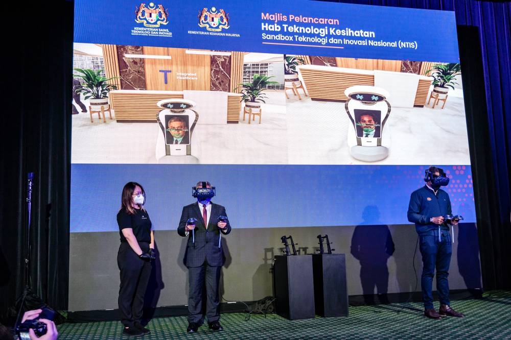 Science, Technology and Innovation Minister Datuk Seri Dr Adham Baba and Health Minister Khairy Jamaluddin attend the launch of the National Technology and Innovation Sandbox (NTIS) Technology Health Hub at MRANTI Park in Bukit Jalil, Kuala Lumpur on September 2, 2022. — Picture by Firdaus Latif