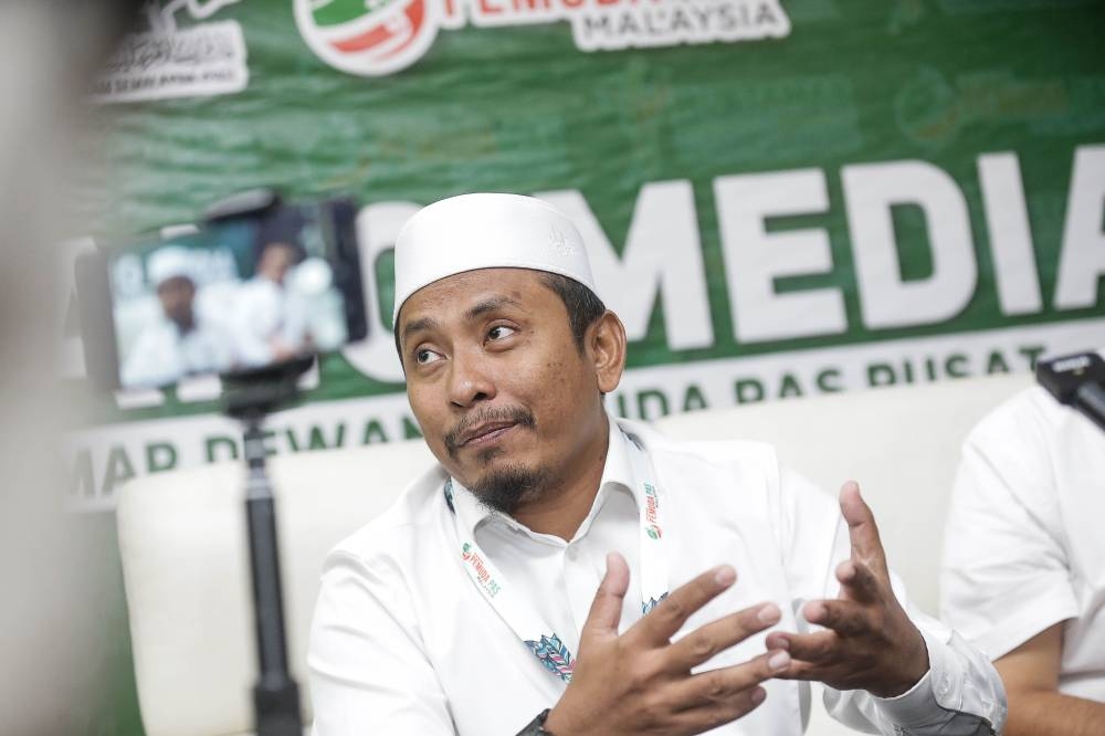 PAS Youth Chief Ahmad Fadhil Shaari speaks to the press during the Youth Conference of the 68th Muktamar Pas (Annual Congress) at Raia Hotel and Convention Centre, Alor Setar September 2, 2022. — Picture by Sayuti Zainudin