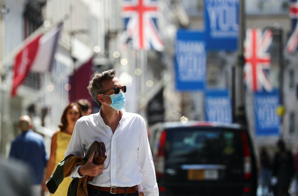 File photo of a shopper wearing a face mask in Old Bond Street, amid the coronavirus disease outbreak, in London, Britain, July 18, 2020. — Reuters pic