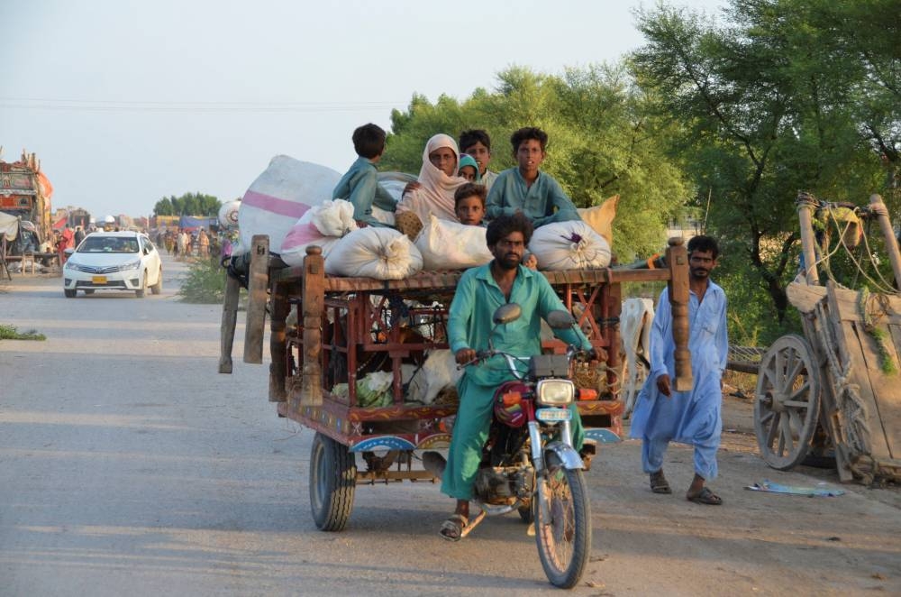 A flood victim family travels with their belongings for a higher ground, following rains and floods during the monsoon season in Dera Allah Yar, District Jafferabad, Pakistan September 2, 2022. — Reuters pic