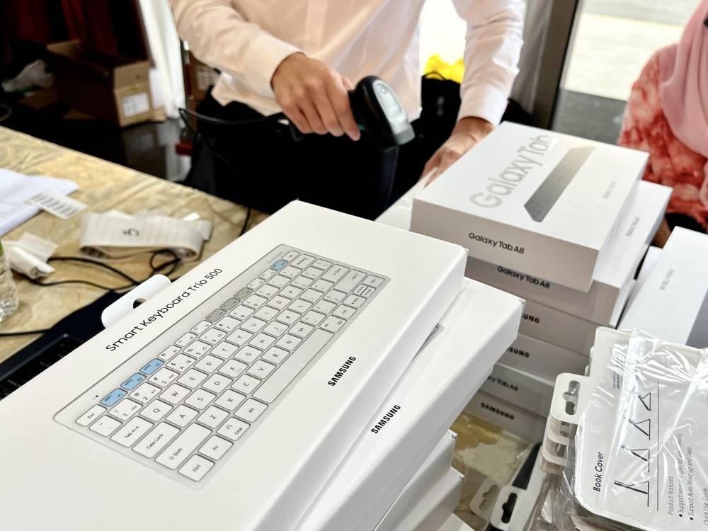 The PerantiSiswa bundle included a Samsung Galaxy Tab A8 LTE tablet, a Bluetooth keyword, a stylus, and a case. — Picture by Ashley Yeong