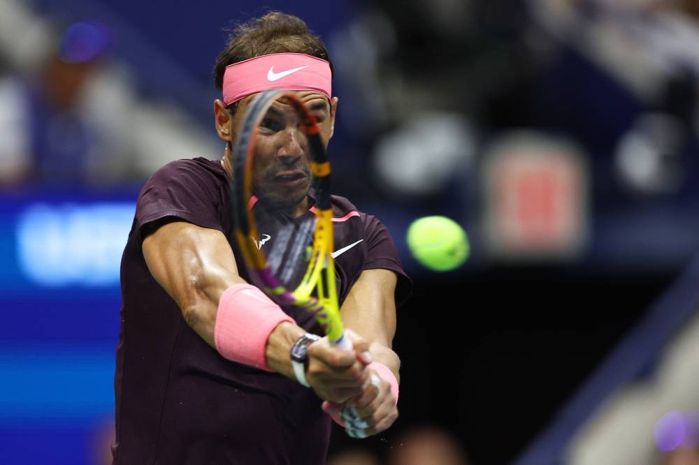 Rafael Nadal of Spain plays a backhand against Richard Gasquet of France during their Men's Singles Third Round match on Day Six of the 2022 US Open at USTA Billie Jean King National Tennis Center on September 03, 2022 in the Flushing neighborhood of the Queens borough of New York City. — Getty Images/AFP pic