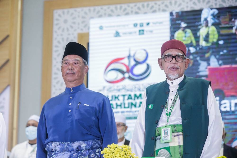 PAS president Tan Sri Abdul Hadi Awang (right) and Bersatu counterpart, Tan Sri Muhyiddin Yassin, attend the 68th PAS Muktamar in Kota Sarang Semut on September 3, 2022. — Picture by Sayuti Zainudin