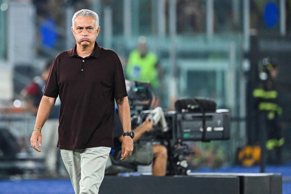 AS Roma's Portuguese coach Jose Mourinho reacts during the Italian Serie A football match between AS Roma and Monza on August 30, 2022 at the Olympic stadium in Rome. — AFP pic