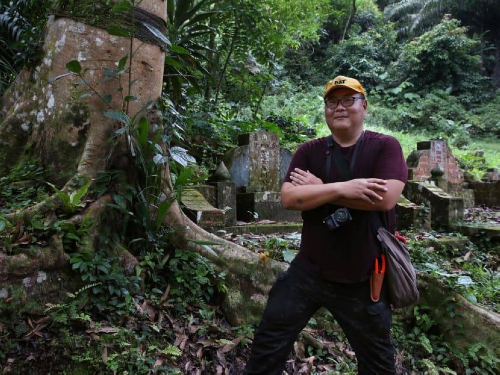 Mr Peter Pak has been documenting tombstones in Bukit Brown Cemetery for the last decade. — TODAY pic