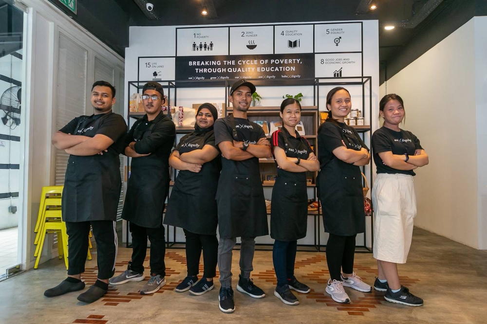 Head chef Mohammad Izauni aka ‘Chef John’ and his eat X cafe team. — Picture by Raymond Manuel