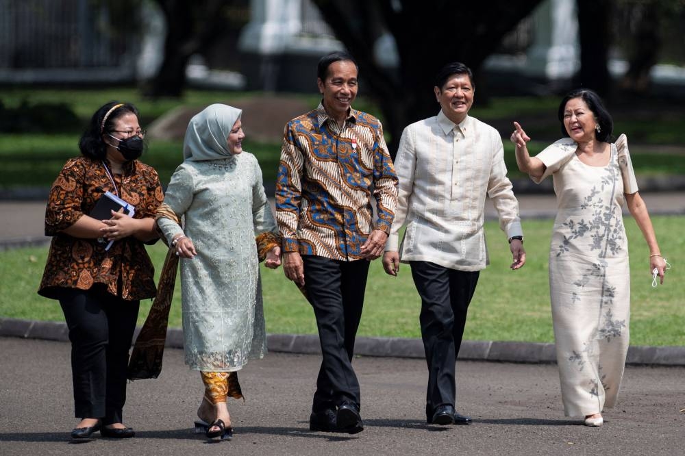 Philippine President Ferdinand 'Bongbong' Marcos Jr. and his wife Louise Araneta-Marcos talk to Indonesian President Joko Widodo and wife Iriana Joko Widodo during their meeting at Presidential Palace in Bogor, Indonesia, September 5, 2022, in this photo taken by Antara Foto. — Antara Foto/Sigid Kurniawan pic via Reuters 