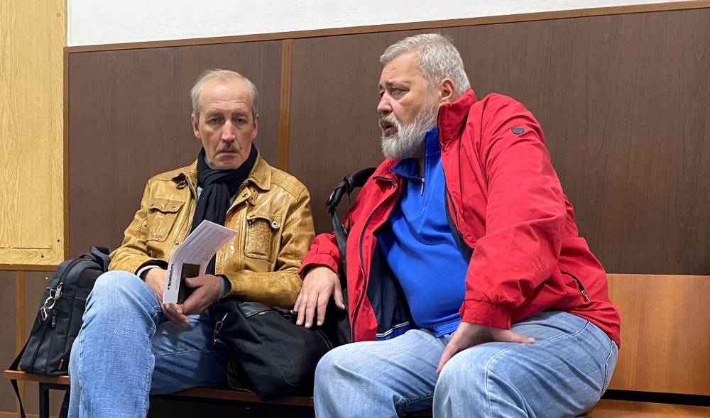 Novaya Gazeta newspaper's editor-in-chief Dmitry Muratov and deputy editor-in-chief Sergei Sokolov sit in a corridor before a court hearing of a case to revoke the newspaper's media license in Moscow, Russia, September 5, 2022. — Reuters pic