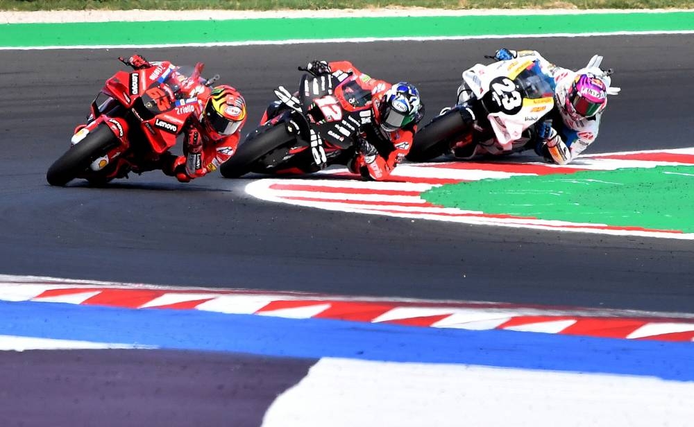 Ducati Lenovo’s Francesco Bagnaia, Aprilia Racing’s Maverick Vinales and Gresini Racing MotoGP’s Enea Bastianini in action during the MotoGP race at Misano World Circuit Marco Simoncelli, Misano Adriatico, San Marino, September 4, 2022. — Reuters pic 