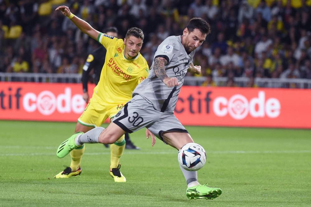 Paris Saint-Germain forward Lionel Messi fights for the ball with Nantes midfielder Andrei Girotto during the French L1 match at the Stade de la Beaujoire Louis Fonteneau in Nantes, western France, September 3, 2022. — AFP pic