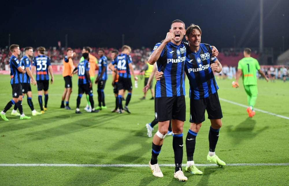 Atalanta's Merih Demiral and Rafael Toloi celebrate after the match against Monza at Stadio Brianteo, Monza September 5, 2022. — Reuters pic