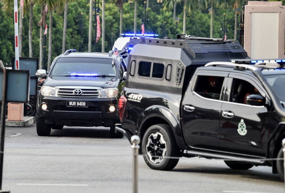 An SUV transporting Datuk Seri Najib Razak accompanied by police and the Prisons Department pictured arrives at the Kuala Lumpur Court Complex for his 1MDB trial, September 6, 2022. — Bernama pic 