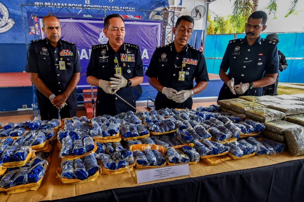Acting Kelantan Police chief Datuk Muhamad Zaki Harun (2nd left) with the seized drugs at the Kelantan police headquarters in Kota Baru, September 7, 2022. — Bernama pic 