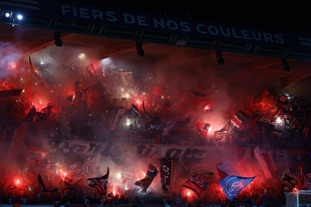 Paris St Germain fans let off flares inside the stadium before the match against Juventus at the Parc des Princes, Paris September 6, 2022. — Reuters pic
