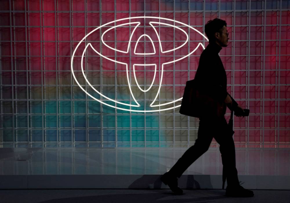 A man walks past a Toyota logo at the Tokyo Motor Show, in Tokyo, Japan October 24, 2019. — Reuters pic